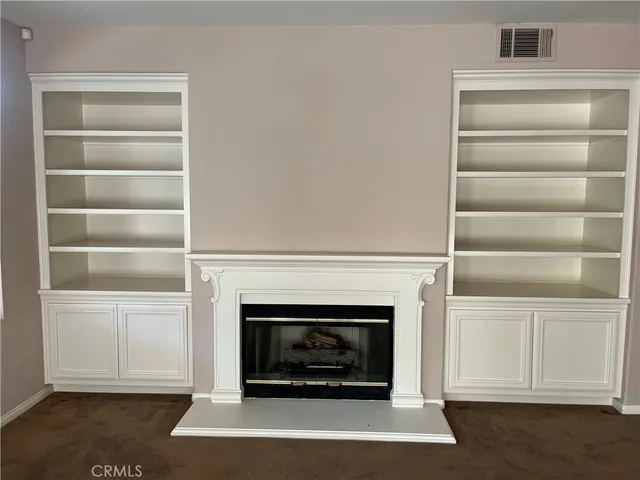 a living room with a fireplace