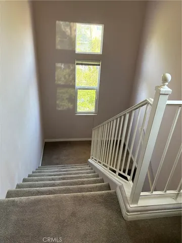 a view of entryway with wooden floor and a window
