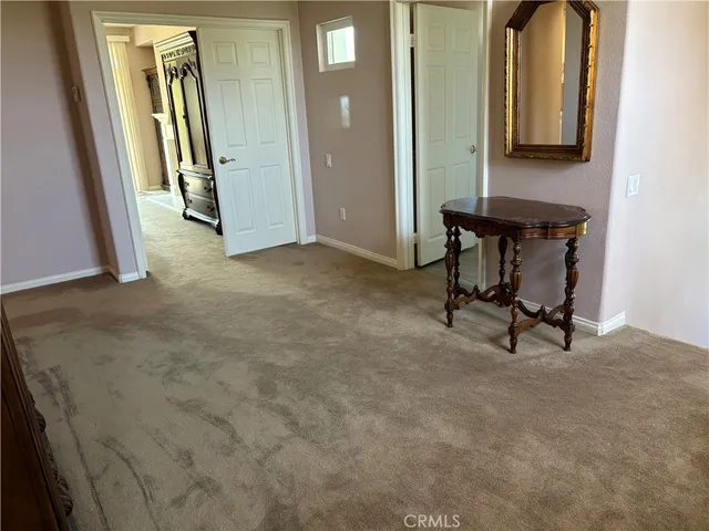 an entryway with a mirror