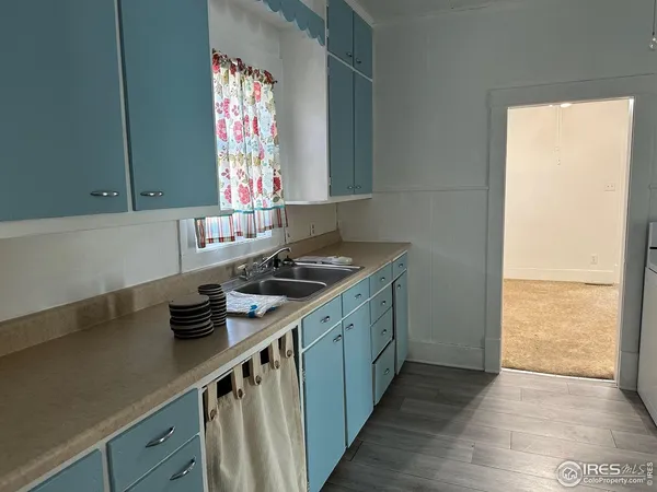 a kitchen with a sink and a window
