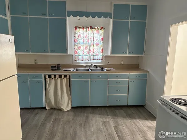 a kitchen with a sink and a stove
