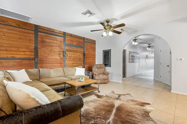 a living room with furniture and a fireplace