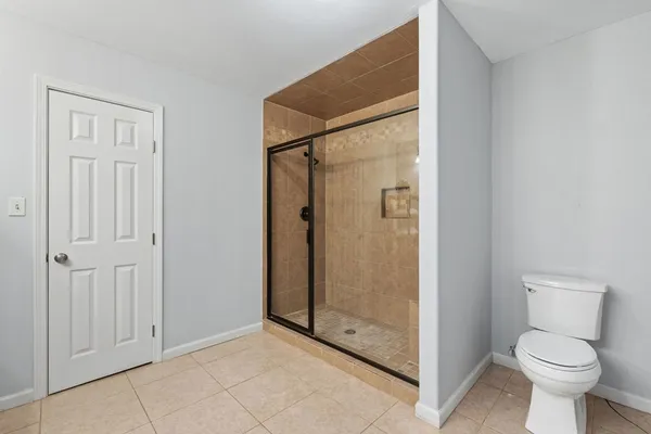 a bed room with a bed and a table