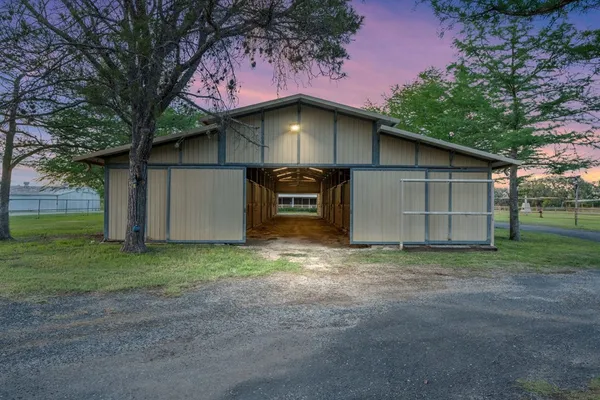 a view of a house with a yard and garage