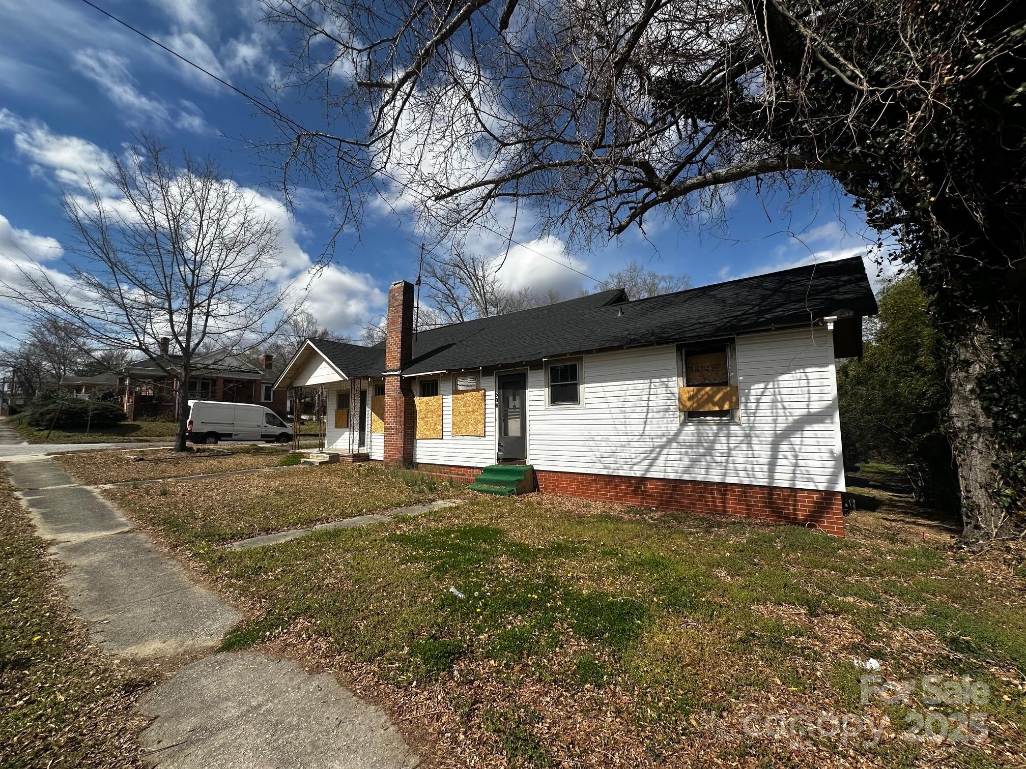 306 East Arch Street Lancaster, SC 29720 - Photo 3 of 4 a front view of a house with a yard