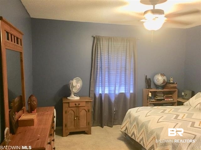 5925 Dixie Lane Mobile, AL 36693 - Photo 5 of 19 Bedroom featuring light carpet and ceiling fan