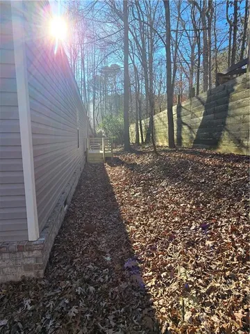 a view of a backyard with trees