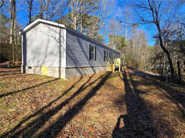 a house with trees in the background
