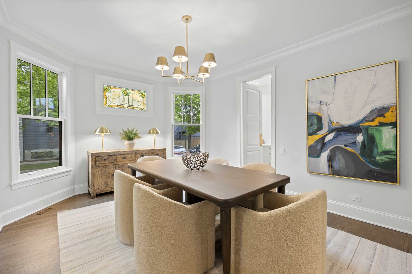 3902 North Hamilton Avenue Chicago, IL 60618 - Photo 11 of 67 a view of a dining room with furniture a chandelier and wooden floor
