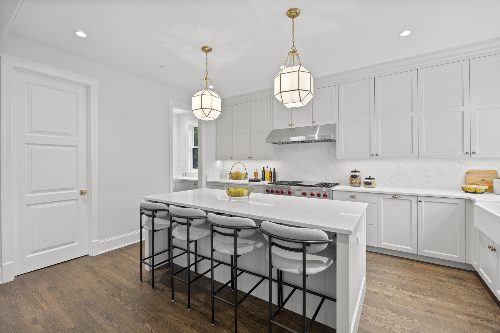 3902 North Hamilton Avenue Chicago, IL 60618 - Photo 17 of 67 a kitchen with stainless steel appliances a dining table chairs and wooden floor