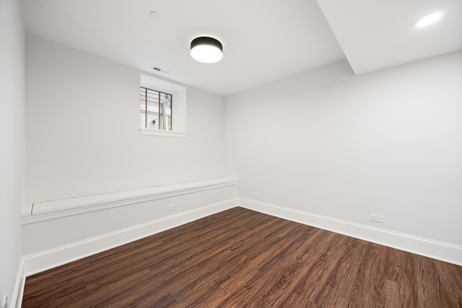 3902 North Hamilton Avenue Chicago, IL 60618 - Photo 36 of 67 a view of a room with wooden floor and white walls