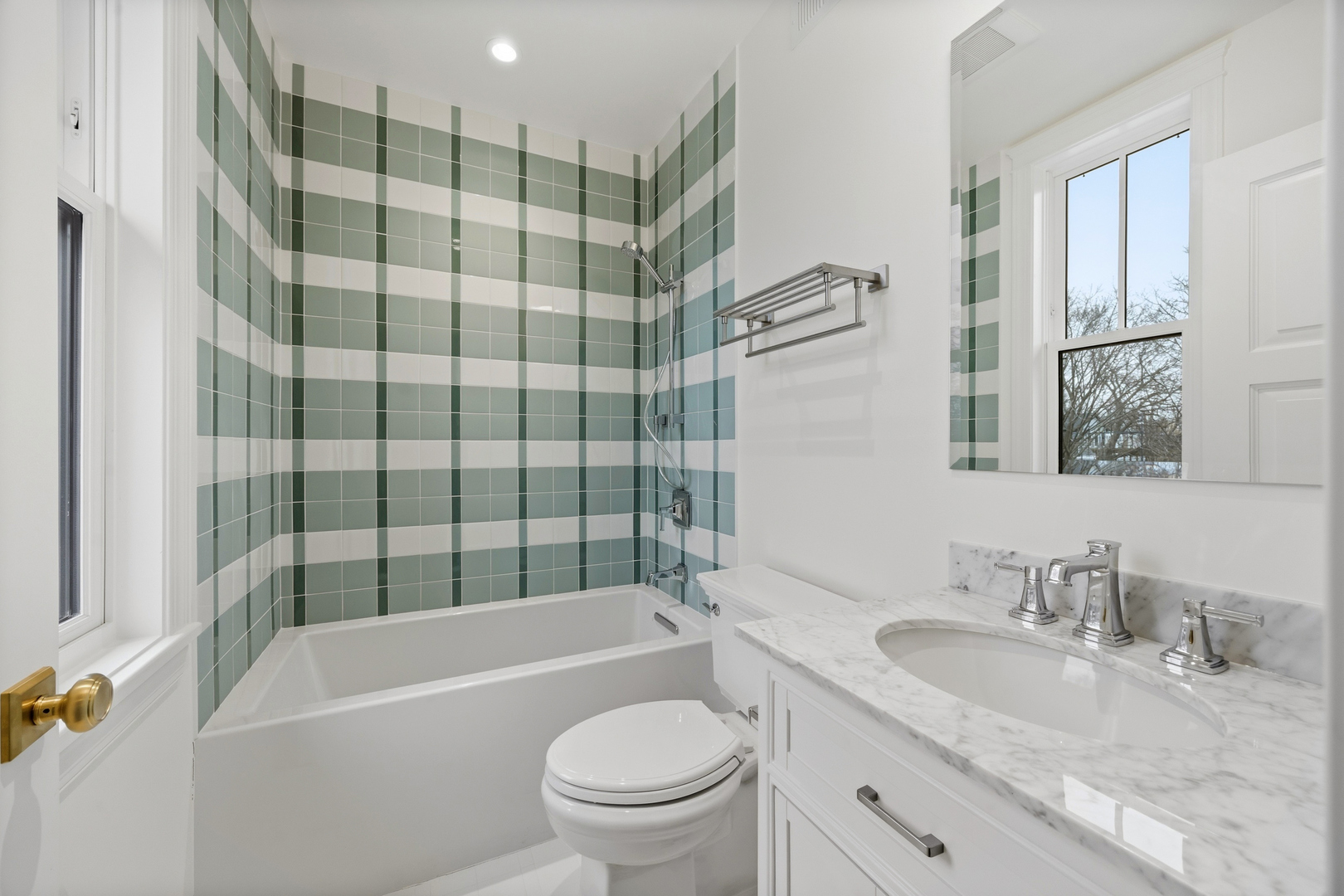 3902 North Hamilton Avenue Chicago, IL 60618 - Photo 50 of 67 a bathroom with a granite countertop toilet a sink and a bathtub