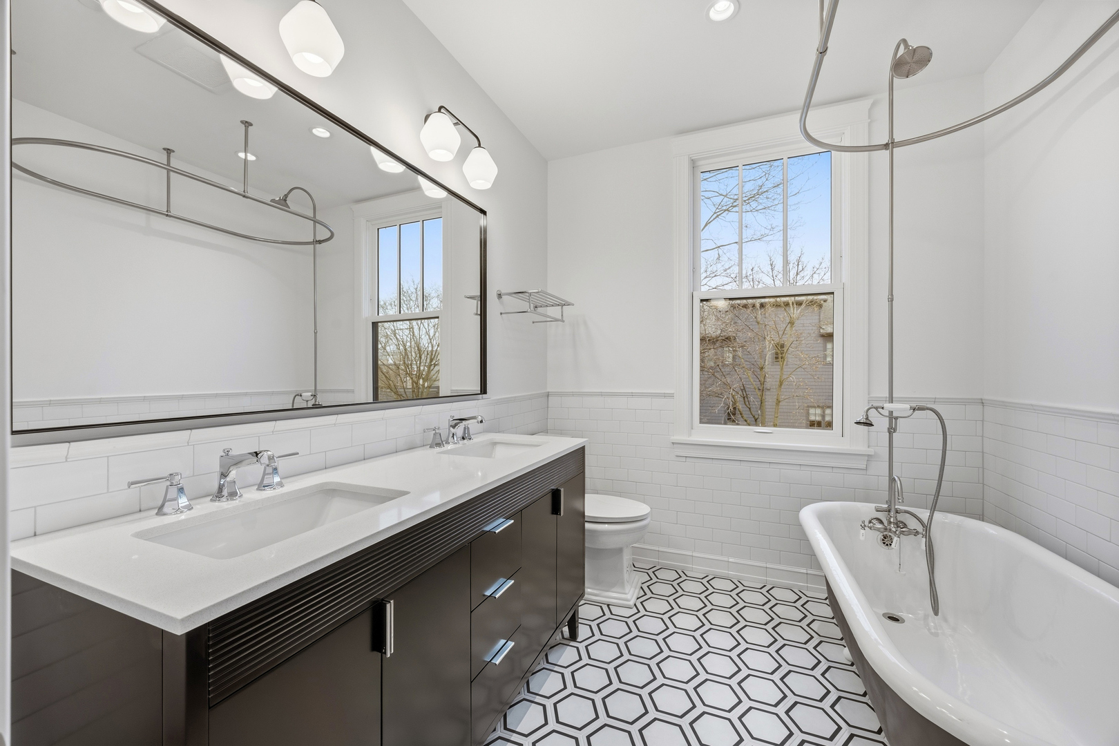 3902 North Hamilton Avenue Chicago, IL 60618 - Photo 52 of 67 a bathroom with a sink double vanity and a bathtub