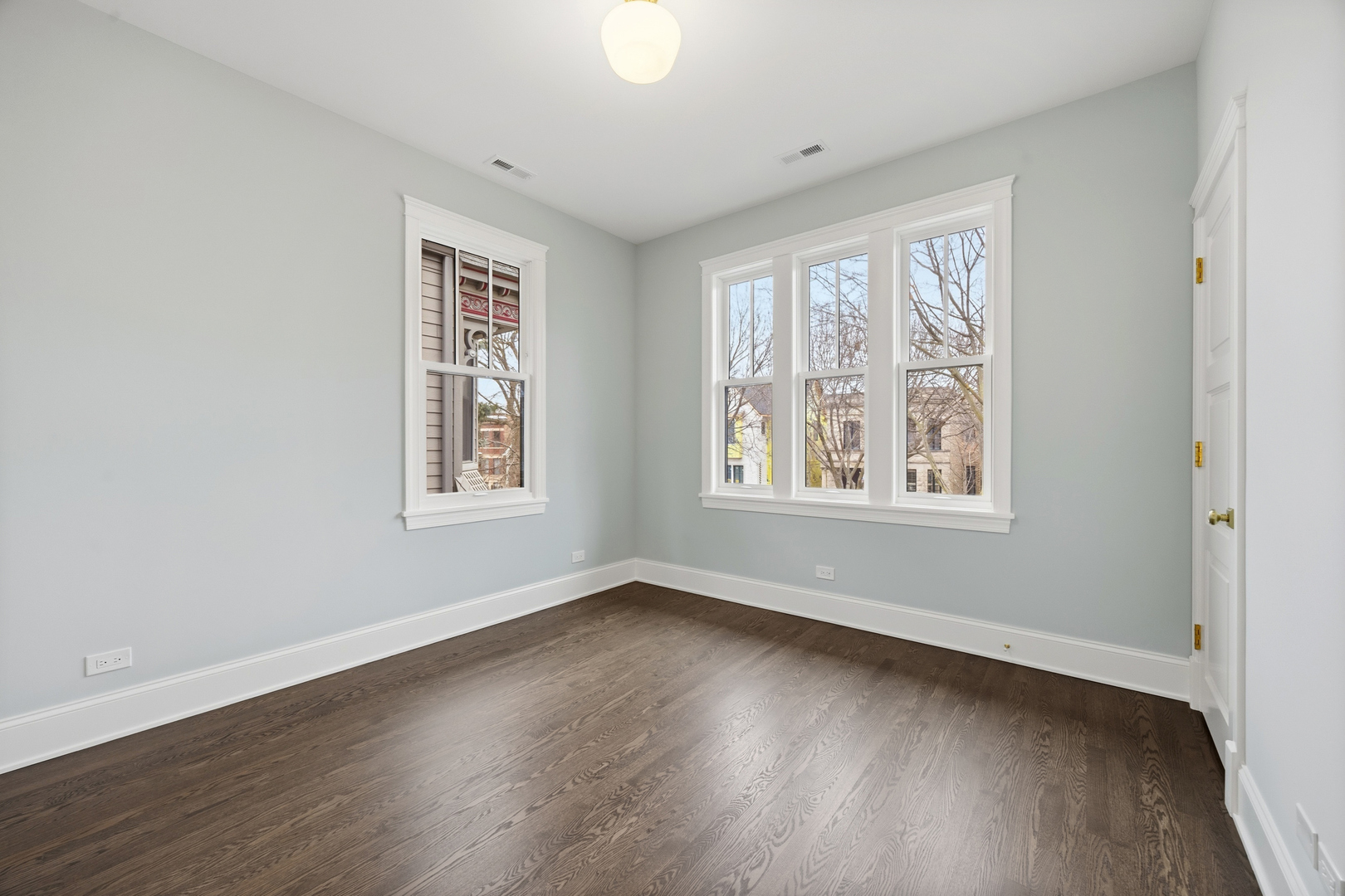 3902 North Hamilton Avenue Chicago, IL 60618 - Photo 53 of 67 a view of an empty room with wooden floor and a window
