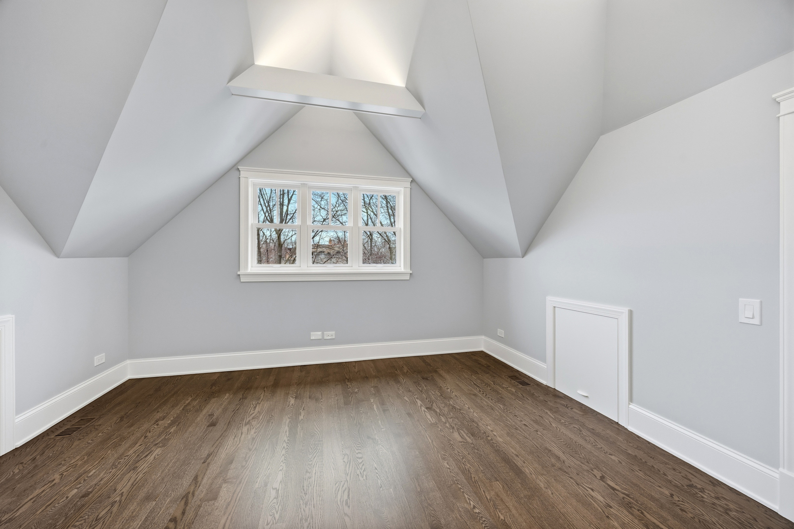 3902 North Hamilton Avenue Chicago, IL 60618 - Photo 58 of 67 an empty room with wooden floor and windows