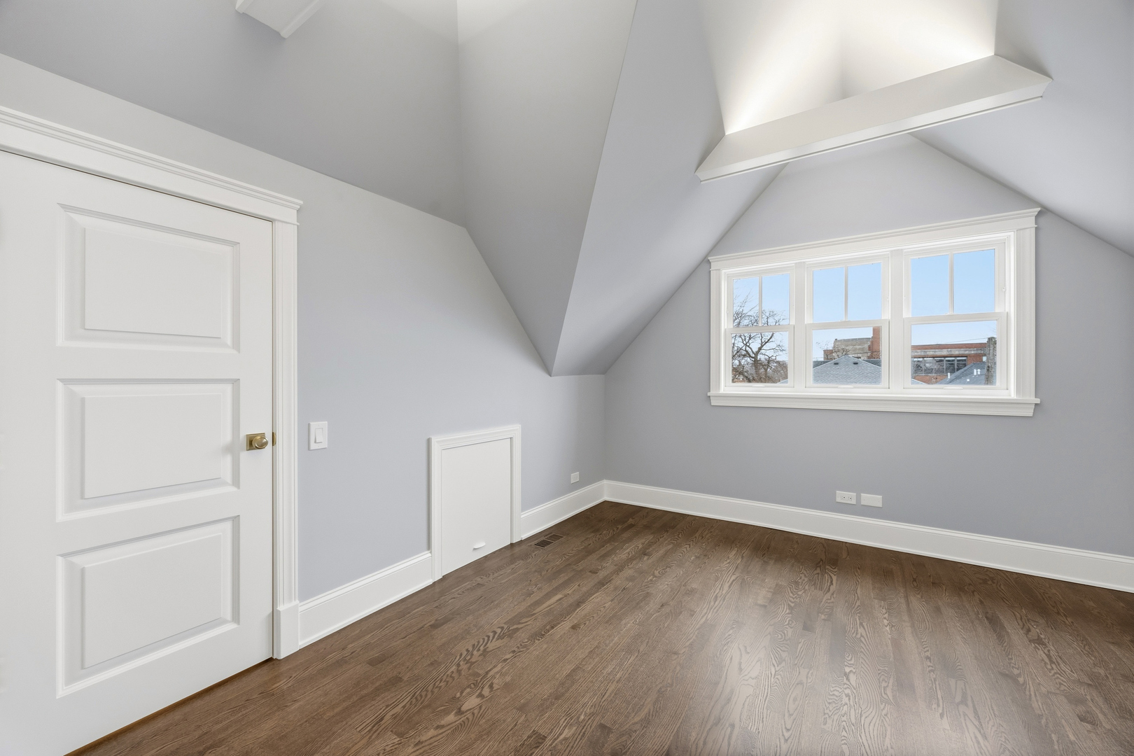 3902 North Hamilton Avenue Chicago, IL 60618 - Photo 61 of 67 an empty room with wooden floor and windows