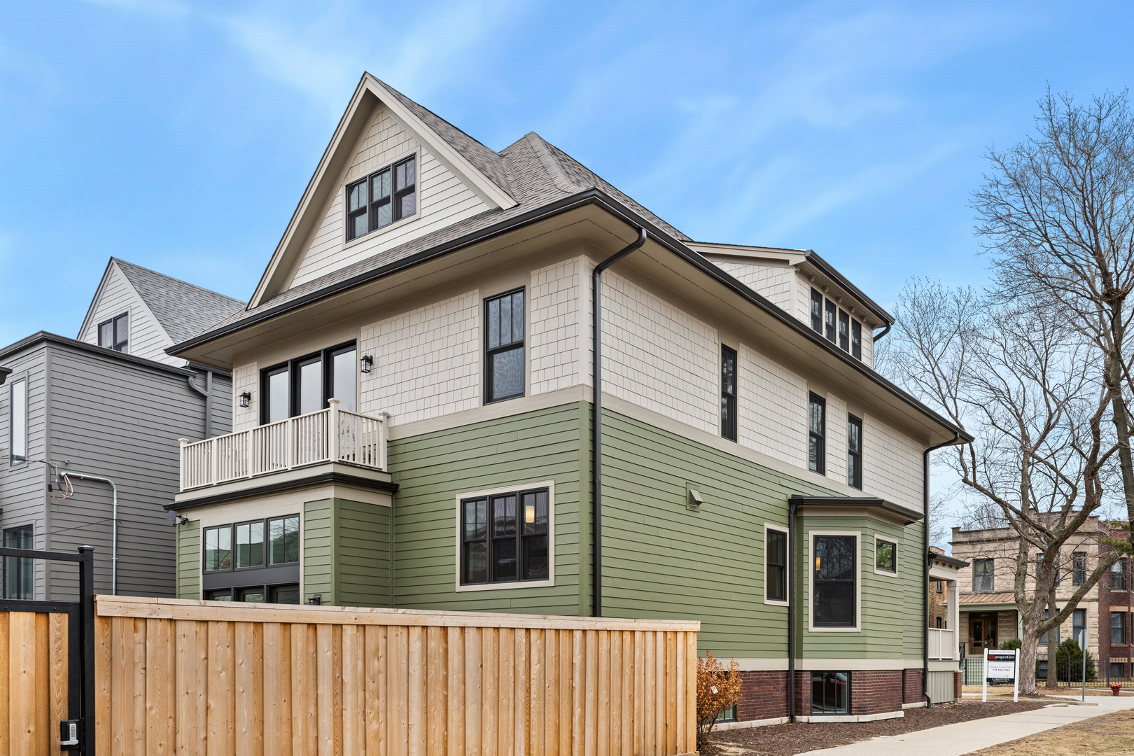 3902 North Hamilton Avenue Chicago, IL 60618 - Photo 62 of 67 a view of a house with a small yard and wooden fence