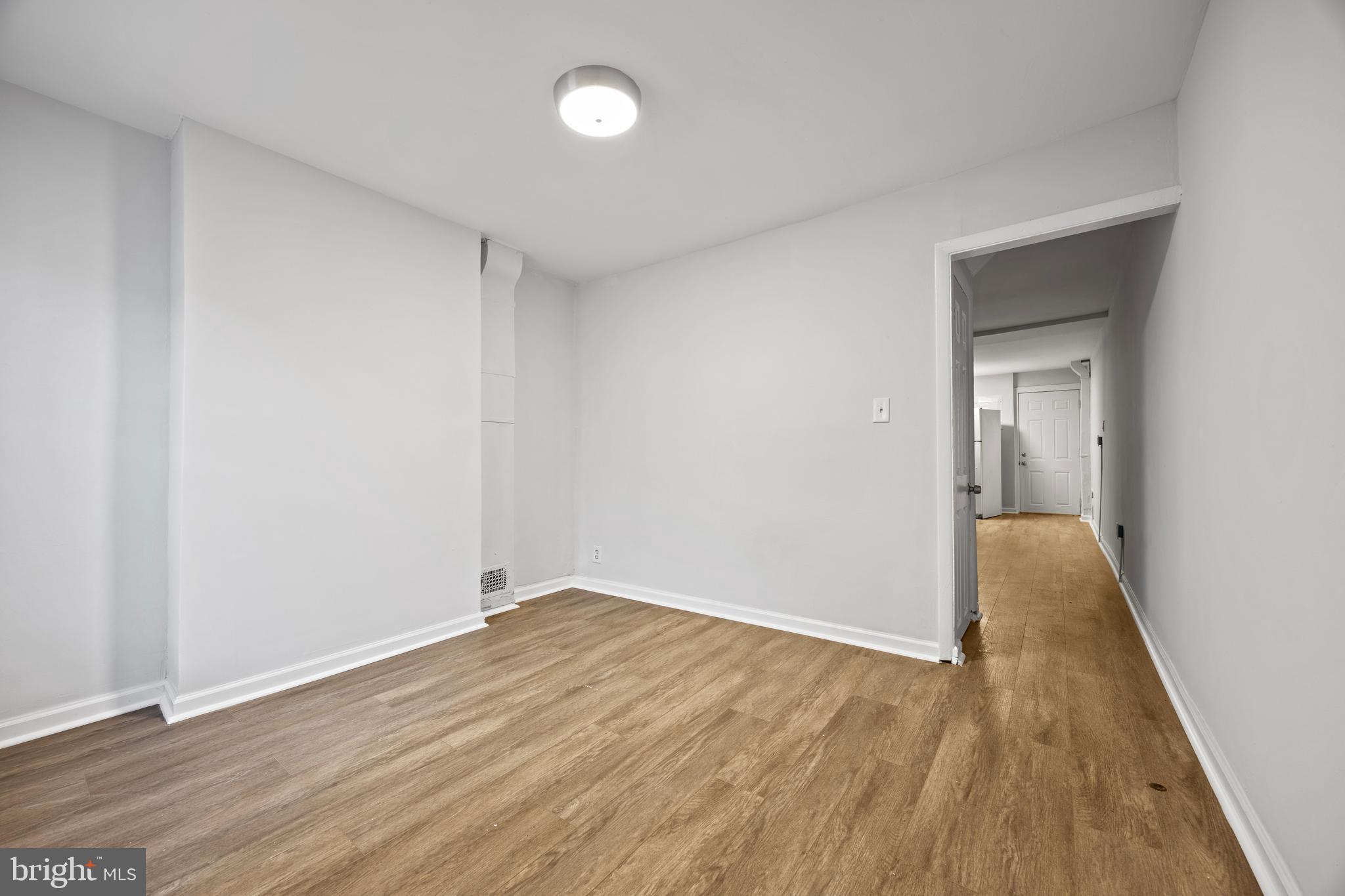 2012 Etting Street Baltimore, MD 21217 - Photo 15 of 23 an empty room with wooden floor and closet