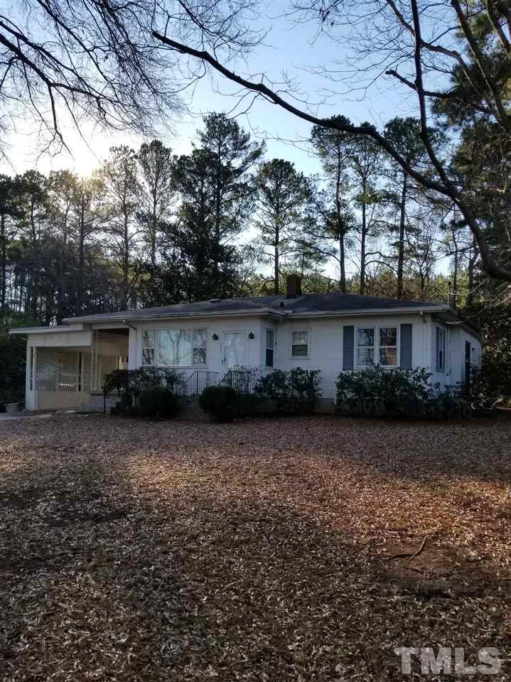 432 Raleigh View Road Raleigh, NC 27610 - Photo 1 of 3 a front view of house with yard and trees in the background