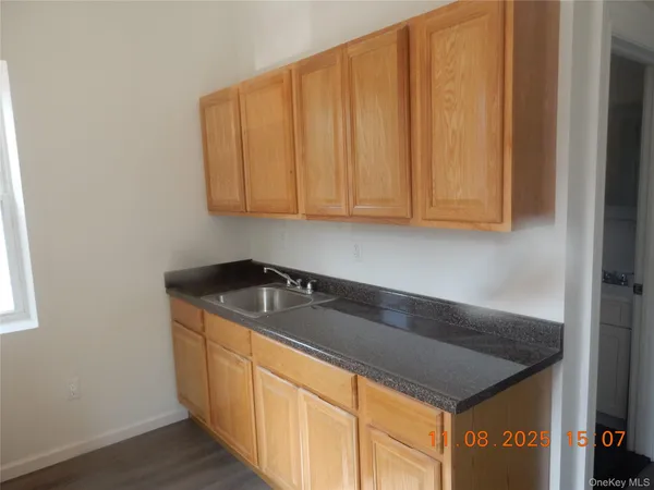 a kitchen with a sink and cabinets