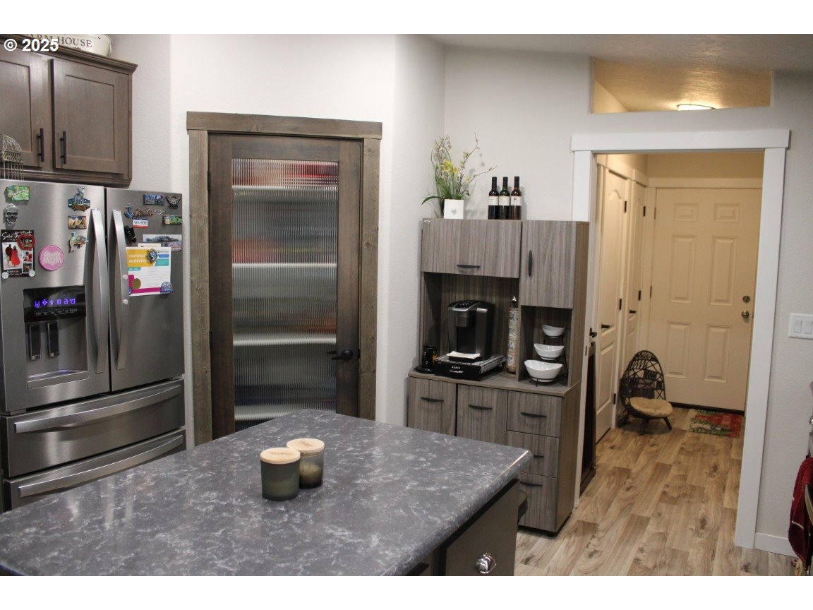 526 Southeast 15th Street Pendleton, OR 97801 - Photo 11 of 31 a kitchen with a refrigerator and a stove