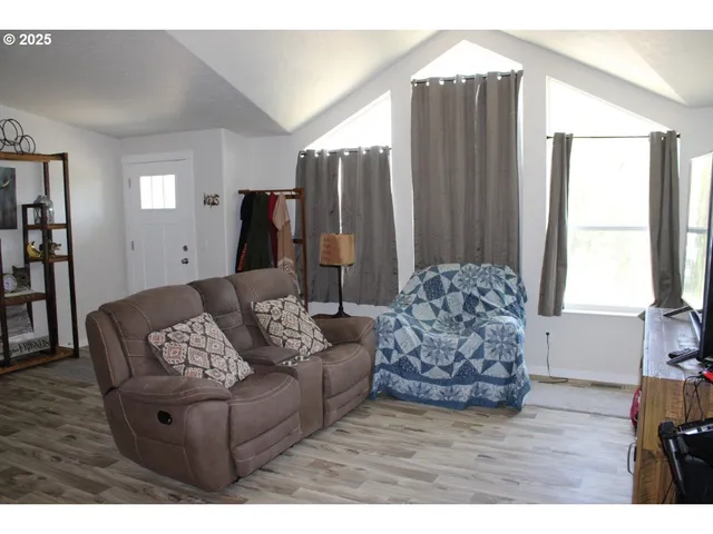 a bedroom with a bed and a book shelf