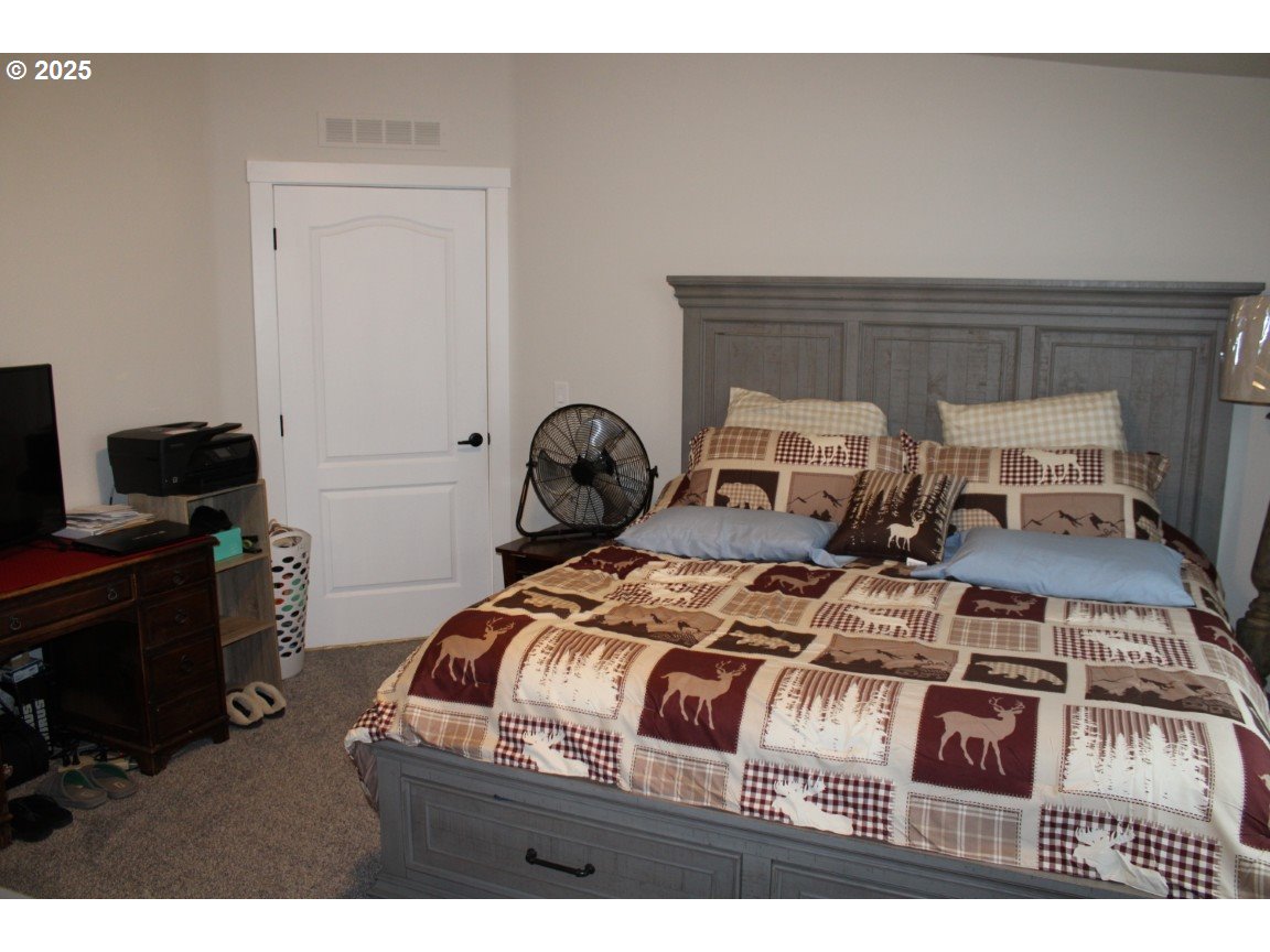 526 Southeast 15th Street Pendleton, OR 97801 - Photo 25 of 31 a bedroom with a bed with wooden floor