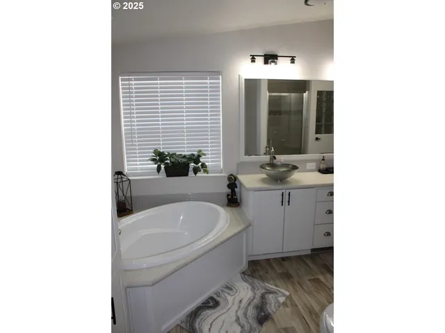 a bathroom with double sink and a mirror