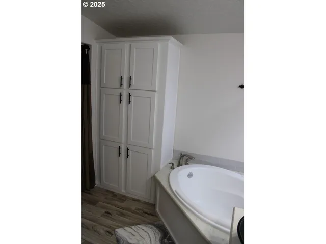 a white toilet sitting next to a white sink