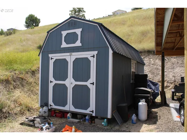 a kitchen with a kitchen island sink stove and microwave