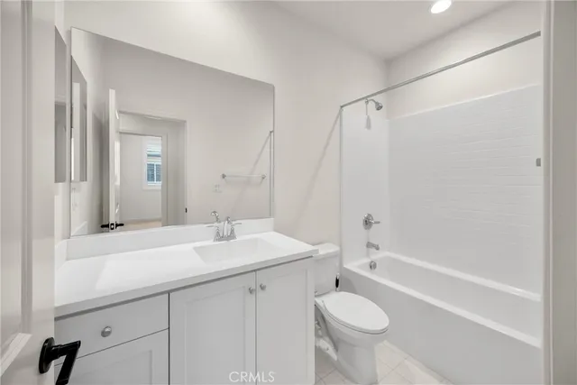 a bathroom with a sink a toilet and a bathtub