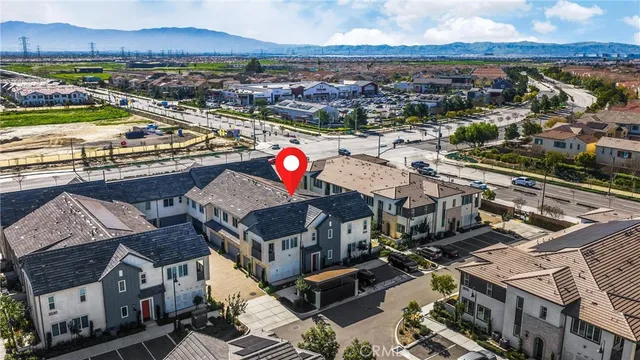 an aerial view of a house with a garden