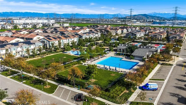 an aerial view of a houses with yard