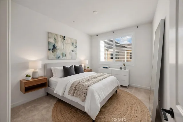 a bedroom with bed and a window