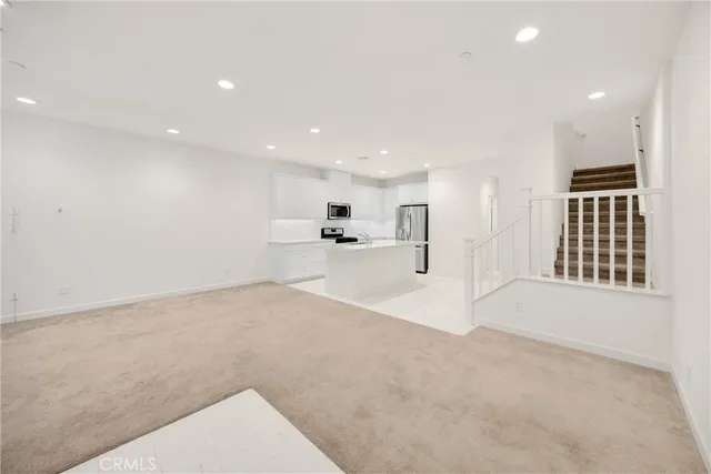 a view of a kitchen with a sink and cabinets