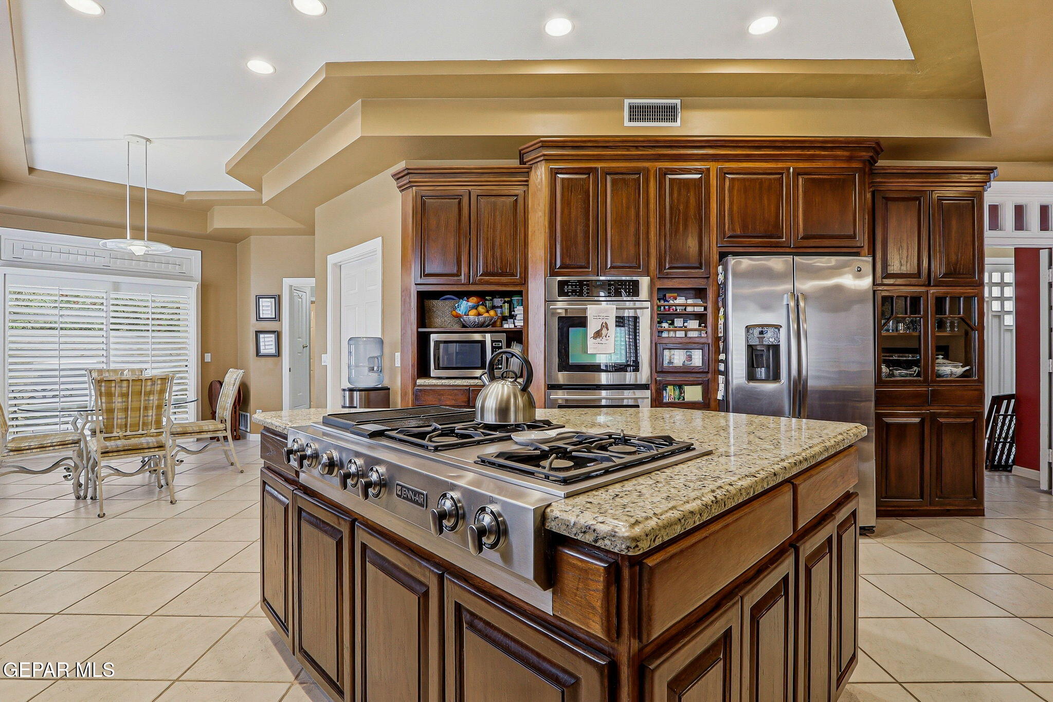 5806 Diamond Point Circle El Paso, TX 79912 - Photo 15 of 61 a kitchen with a stove and a refrigerator