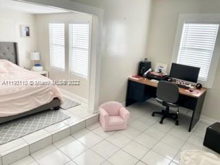 2811 Southwest 17th Street Miami, FL 33145 - Photo 3 of 11 a bedroom with a bed chair and a window