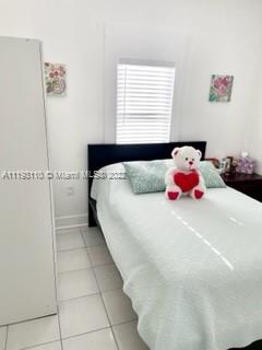 2811 Southwest 17th Street Miami, FL 33145 - Photo 6 of 11 a bedroom with a bed and a window