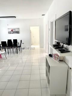 2811 Southwest 17th Street Miami, FL 33145 - Photo 7 of 11 a living room with furniture and a flat screen tv