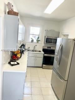 2811 Southwest 17th Street Miami, FL 33145 - Photo 8 of 11 a kitchen with a refrigerator a sink and a stove