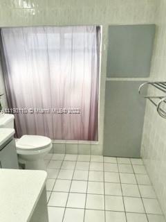 2811 Southwest 17th Street Miami, FL 33145 - Photo 9 of 11 a bathroom with a toilet a sink and shower