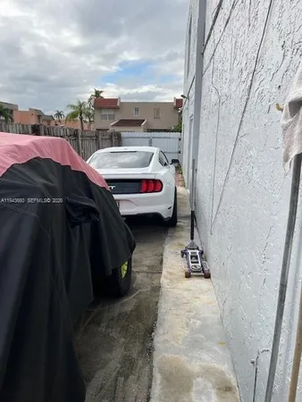 a table and chairs in front of a house