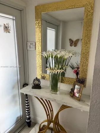 a kitchen with a stove a sink and a refrigerator