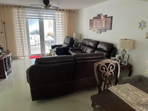 a living room with furniture and a window