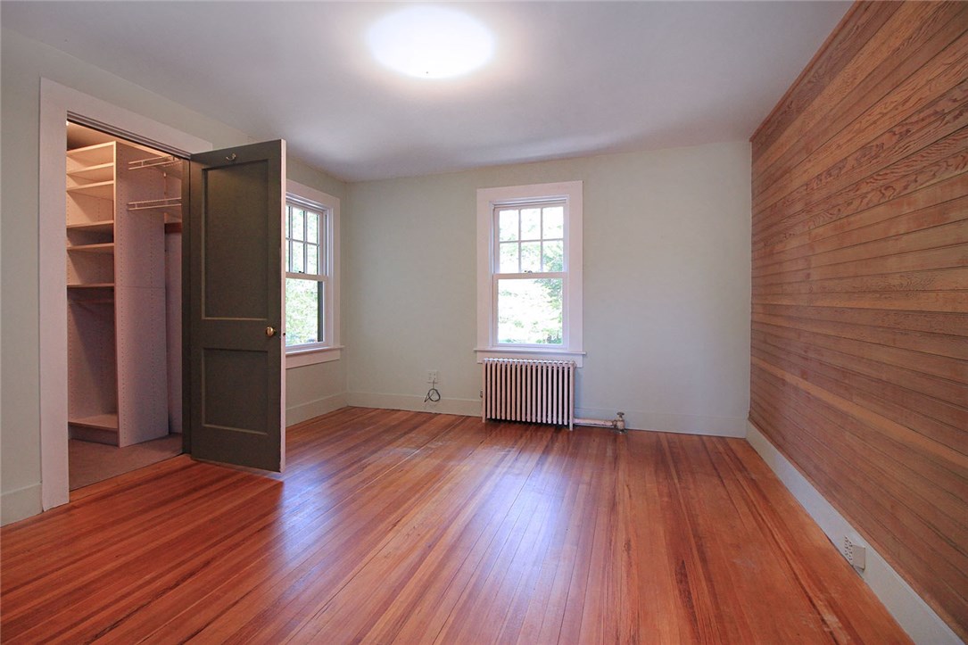 40 Wagner Road Westerly, RI 02891 - Photo 29 of 40 Middle bedroom with walk-in closet & charming raw-wood accent wall. Joanna Gaines would be proud!