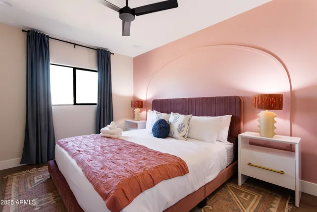 a bedroom with a large bed and a balcony view