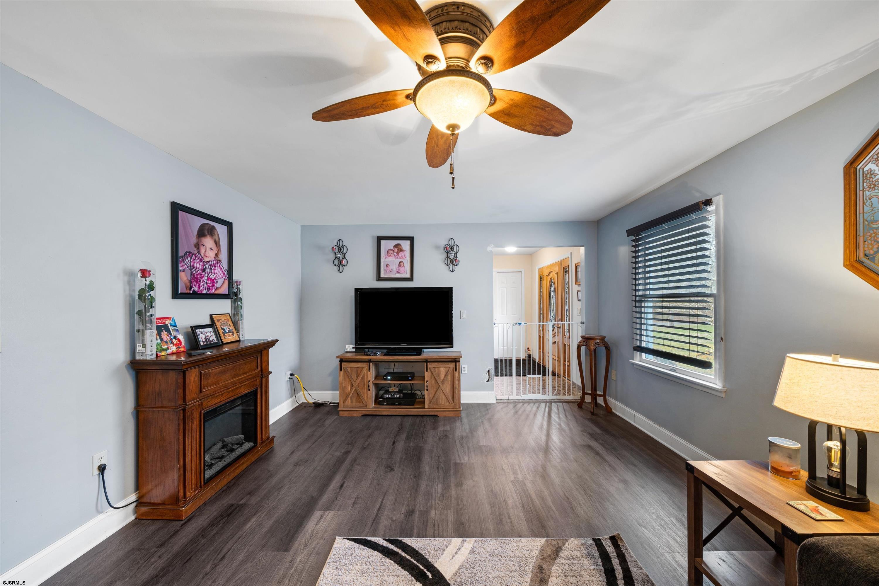 1319 Somers Point Road Egg Harbor Township, NJ 08234 - Photo 25 of 83 a living room with furniture and a flat screen tv