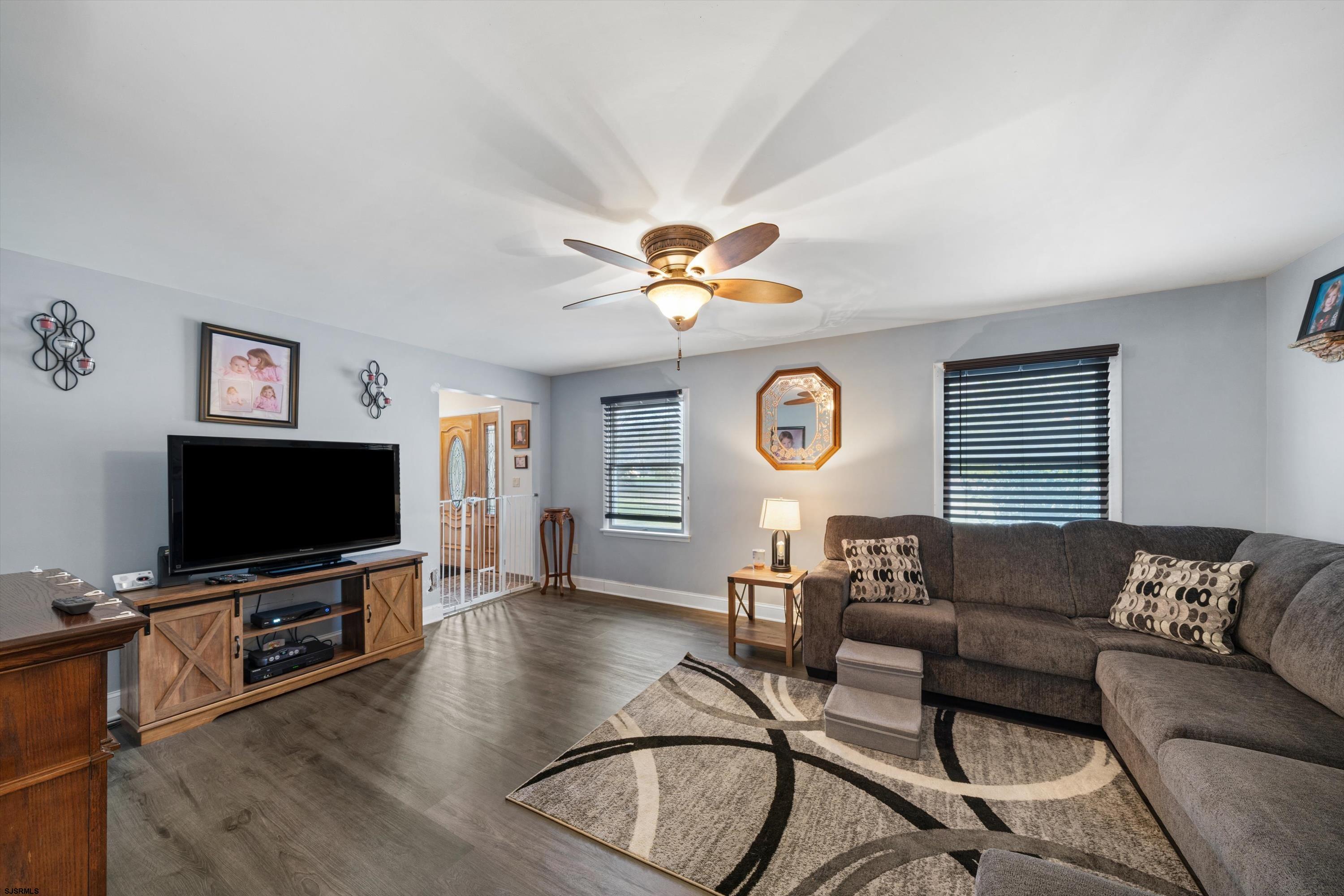1319 Somers Point Road Egg Harbor Township, NJ 08234 - Photo 28 of 83 a living room with furniture and a flat screen tv