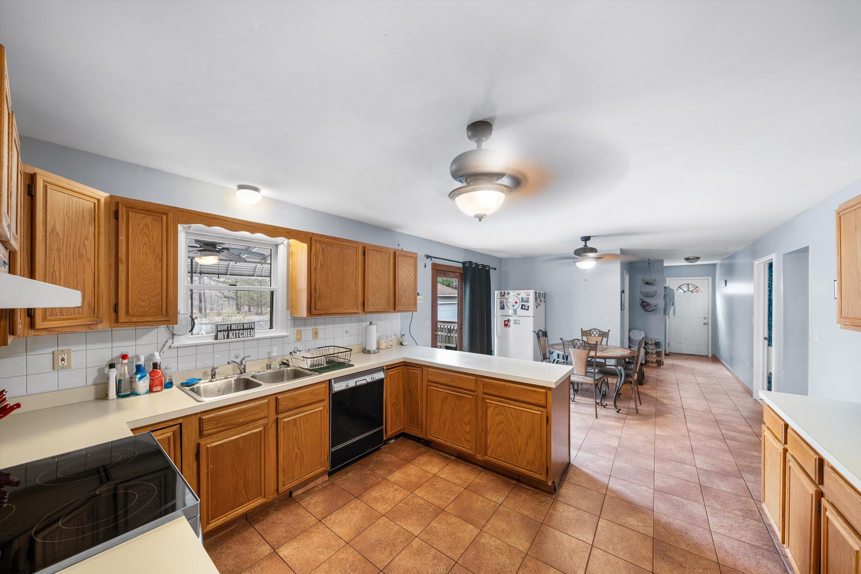 1319 Somers Point Road Egg Harbor Township, NJ 08234 - Photo 36 of 83 a large kitchen with a large counter top space a sink stainless steel appliances and cabinets