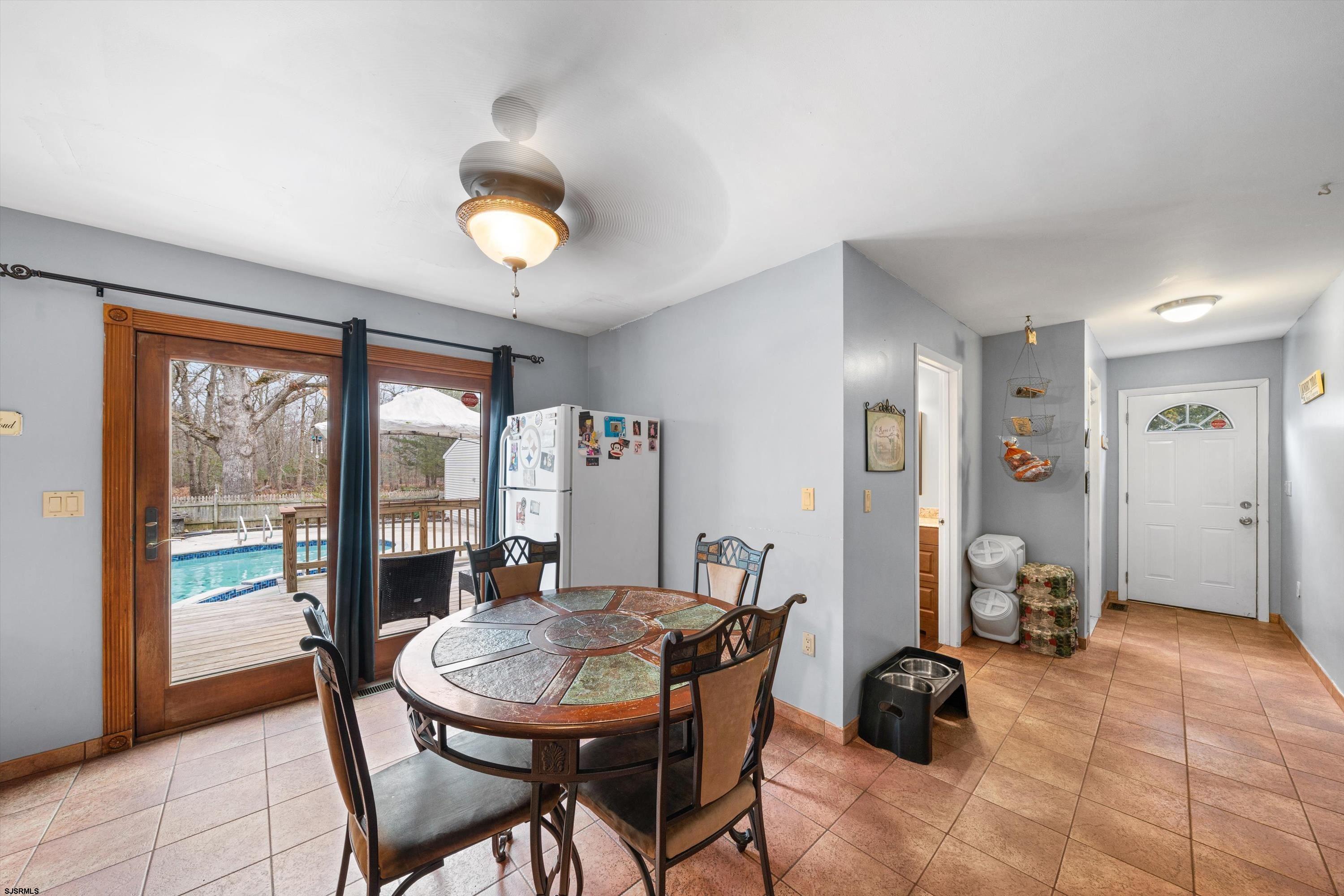 1319 Somers Point Road Egg Harbor Township, NJ 08234 - Photo 48 of 83 a view of a dining room with furniture and a floor to ceiling window
